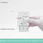 Hand holds test cartridge for ACT analyser insertion