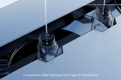 Precise liquid dispensing into glass vials on automated manufacturing line